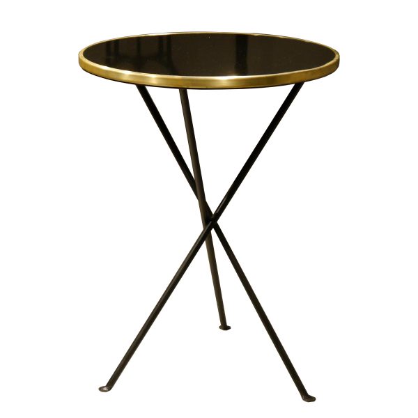 Mesa redonda estilo bauhaus negra y dorada